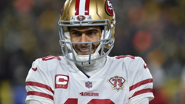 Jan 22, 2022; Green Bay, Wisconsin, USA; San Francisco 49ers quarterback Jimmy Garoppolo (10) in action against the Green Bay Packers during a NFC Divisional playoff football game at Lambeau Field. Mandatory Credit: Jeffrey Becker-USA TODAY Sports