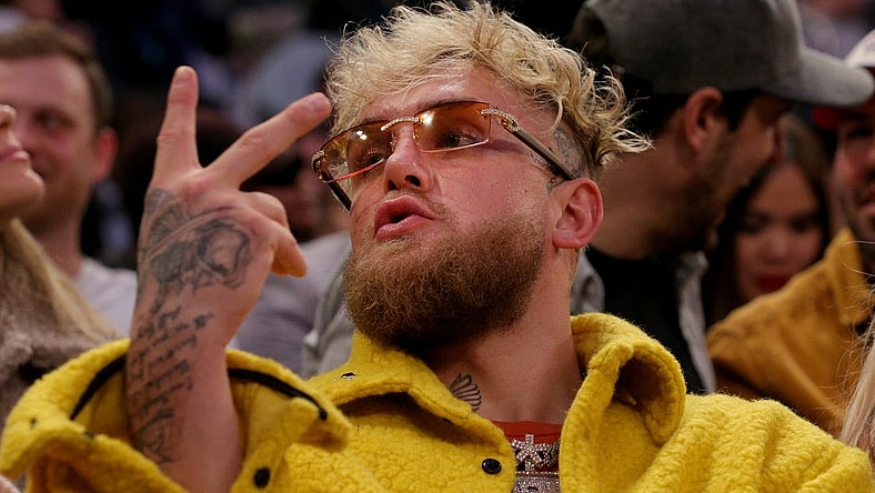 Feb 2, 2022; New York, New York, USA; American boxer Jake Paul gestures at a fan during the third quarter between the New York Knicks and the Memphis Grizzlies at Madison Square Garden. Mandatory Credit: Brad Penner-USA TODAY Sports