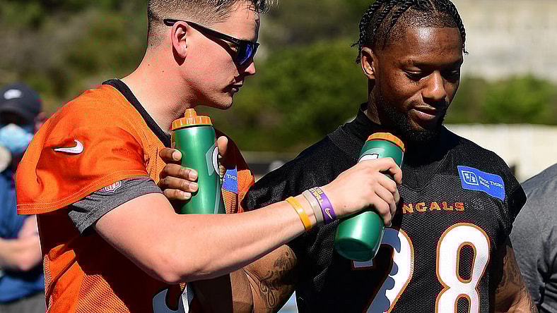 Feb 11, 2022; Los Angeles, CA, USA; Cincinnati Bengals quarterback Joe Burrow (9) and running back Joe Mixon (28) do a mock interview following media availabilty for Super Bowl LVI at Drake Stadium. Mandatory Credit: Gary A. Vasquez-USA TODAY Sports