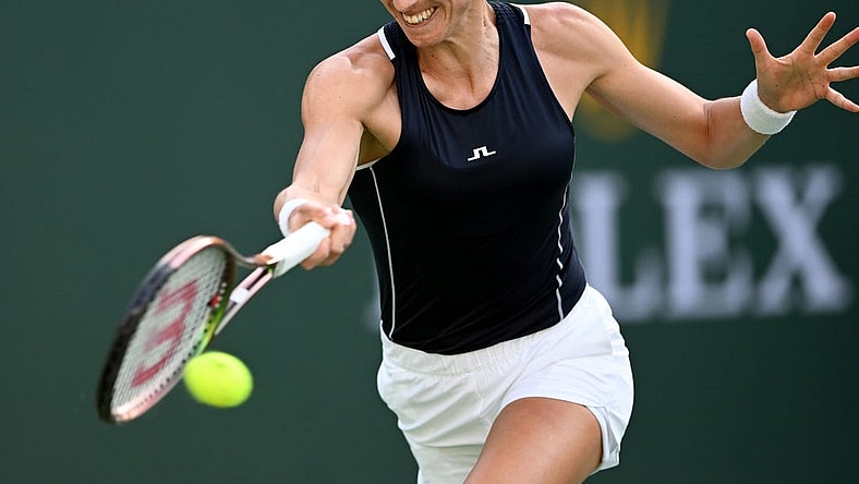 Mar 16, 2022; Indian Wells, CA, USA;  Petra Martic (CRO) hits a shot in her quarterfinal match against Simona Halep (ROM) at the BNP Paribas Open at the Indian Wells Tennis Garden. Mandatory Credit: Jayne Kamin-Oncea-USA TODAY Sports