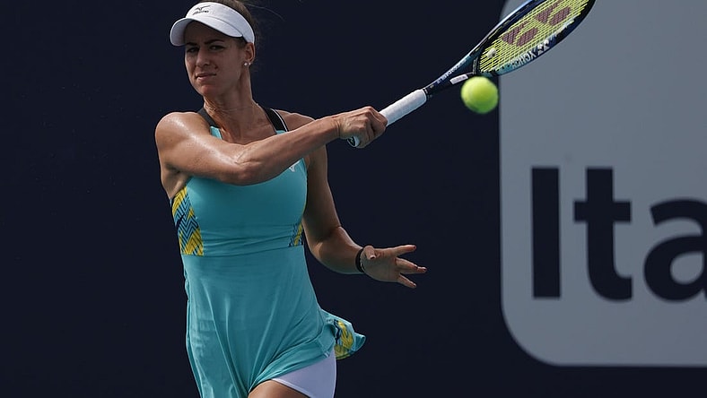 Mar 24, 2022; Miami Gardens, FL, USA; Anna Bondar (HUN) hits a forehand against Danielle Collins (USA) (not pictured) in a second round women's singles match in the Miami Open at Hard Rock Stadium. Mandatory Credit: Geoff Burke-USA TODAY Sports