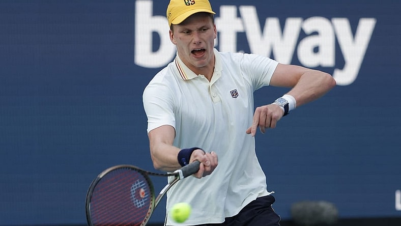 Mar 29, 2022; Miami Gardens, FL, USA; Jenson Brooksby (USA) reacts after winning a point against Daniil Medvedev (not pictured) in a fourth round men's singles match in the Miami Open at Hard Rock Stadium. Mandatory Credit: Geoff Burke-USA TODAY Sports