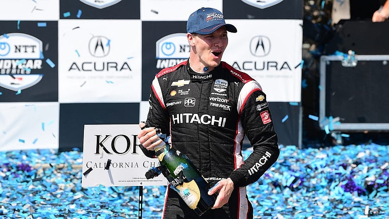 Apr 10, 2022; Long Beach, California, USA; Team Penske driver Josef Newgarden (2) of United States celebrates his victory of the Grand Prix of Long Beach at Long Beach Street Circuit. Mandatory Credit: Gary A. Vasquez-USA TODAY Sports
