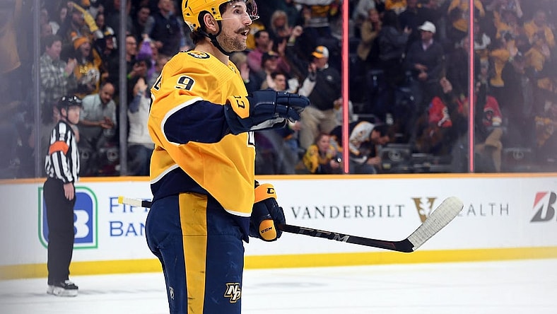 Apr 19, 2022; Nashville, Tennessee, USA; Nashville Predators left wing Filip Forsberg (9) reacts after scoring during the second period against the Calgary Flames at Bridgestone Arena. Mandatory Credit: Christopher Hanewinckel-USA TODAY Sports