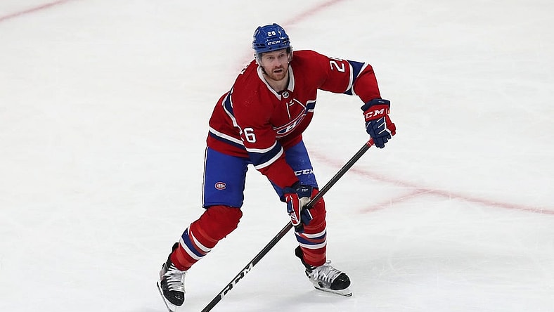 Apr 21, 2022; Montreal, Quebec, CAN; Montreal Canadiens defenseman Jeff Petry (26) makes a pass against Philadelphia Flyers during the second period at Bell Centre. Mandatory Credit: Jean-Yves Ahern-USA TODAY Sports