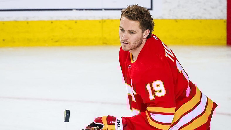 May 15, 2022; Calgary, Alberta, CAN; Calgary Flames left wing Matthew Tkachuk (19) controls the puck during the warmup period against the Dallas Stars in game seven of the first round of the 2022 Stanley Cup Playoffs at Scotiabank Saddledome. Mandatory Credit: Sergei Belski-USA TODAY Sports
