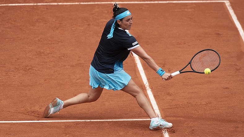 May 22, 2022; Paris, France;  Ons Jabeur (TUN) returns the ball during her match against Magda Linette (POL) on day one of the French Open at Stade Roland-Garros. Mandatory Credit: Susan Mullane-USA TODAY Sports