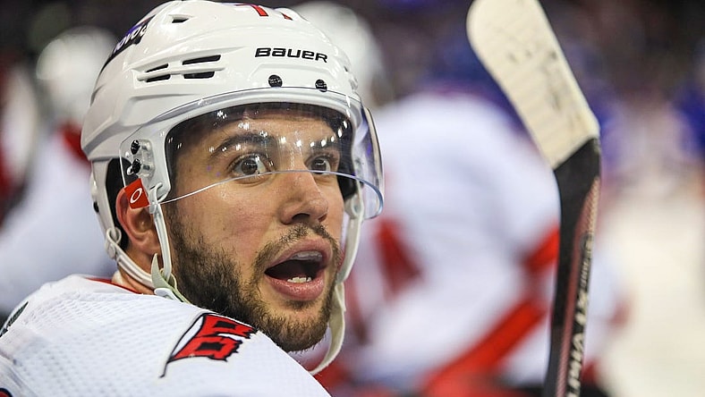 May 24, 2022; New York, New York, USA; Carolina Hurricanes defenseman Tony DeAngelo (77) catches this breath on the bench during a timeout against the New York Rangers during the third period in game four of the second round of the 2022 Stanley Cup Playoffs at Madison Square Garden. Mandatory Credit: Danny Wild-USA TODAY Sports