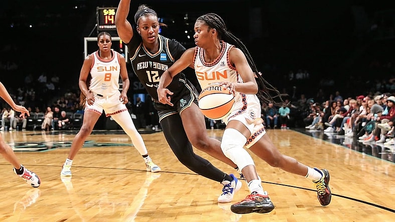 May 17, 2022; Brooklyn, New York, USA;  Connecticut Sun guard Nia Clouden (11) and New York Liberty forward Michaela Onyenwere (12) at Barclays Center. Mandatory Credit: Wendell Cruz-USA TODAY Sports