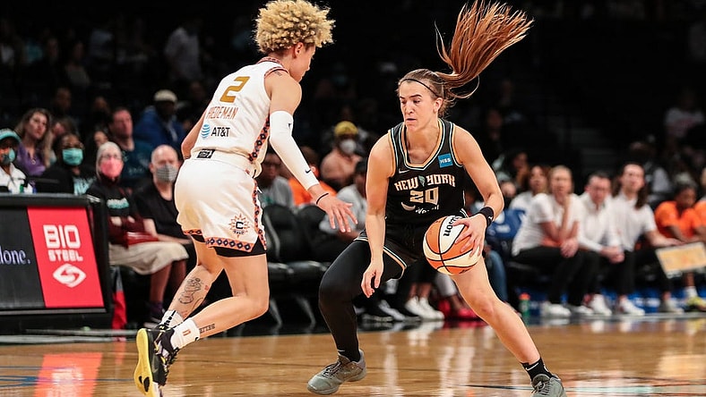 May 17, 2022; Brooklyn, New York, USA;  New York Liberty guard Sabrina Ionescu (20) and Connecticut Sun guard Natisha Hiedeman (2) at Barclays Center. Mandatory Credit: Wendell Cruz-USA TODAY Sports