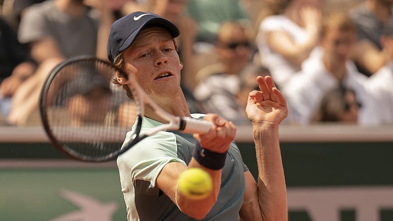 May 28, 2022; Paris, France; Jannik Sinner (ITA) returns a shot from MacKenzie McDonald (USA) during their match on day seven of the French Open at Stade Roland-Garros. Mandatory Credit: Susan Mullane-USA TODAY Sports