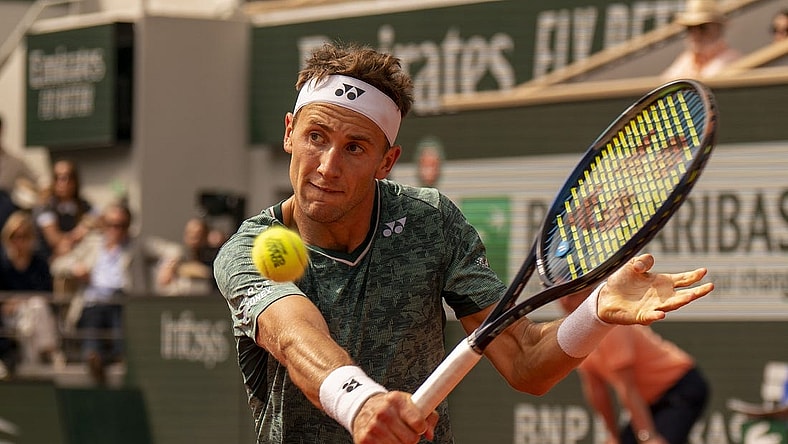 June 5, 2022; Paris, France; Casper Ruud (NOR) returns a shot during the men s singles final against Rafael Nadal (ESP) on day 15 of the French Open at Stade Roland-Garros. Mandatory Credit: Susan Mullane-USA TODAY Sports