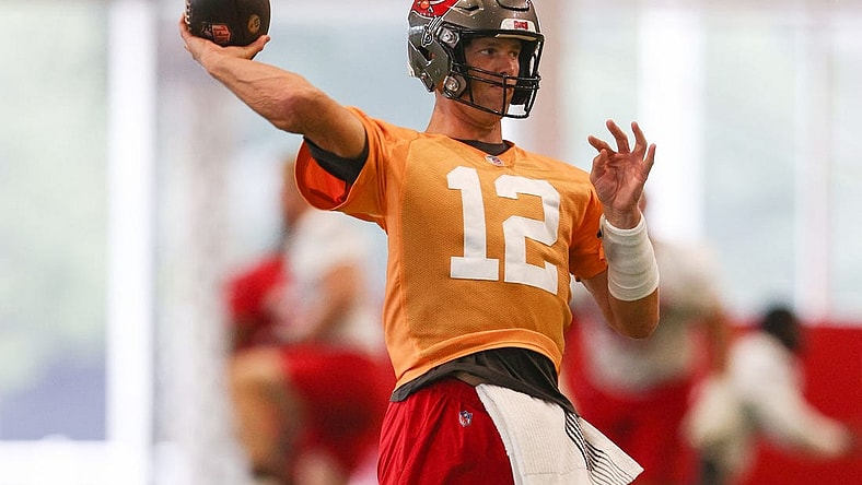Jun 9, 2022; Tampa, FL, USA;  Tampa Bay Buccaneers quarterback Tom Brady (12) participates in mandatory mini camp at AdventHealth Training Center Mandatory Credit: Nathan Ray Seebeck-USA TODAY Sports