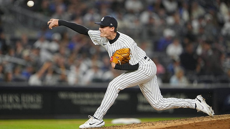 Jun 11, 2022; Bronx, New York, USA; New York Yankees pitcher Ron Marinaccio (97) delivers a pitch against the Chicago Cubs during the eighth inning at Yankee Stadium. Mandatory Credit: Gregory Fisher-USA TODAY Sports