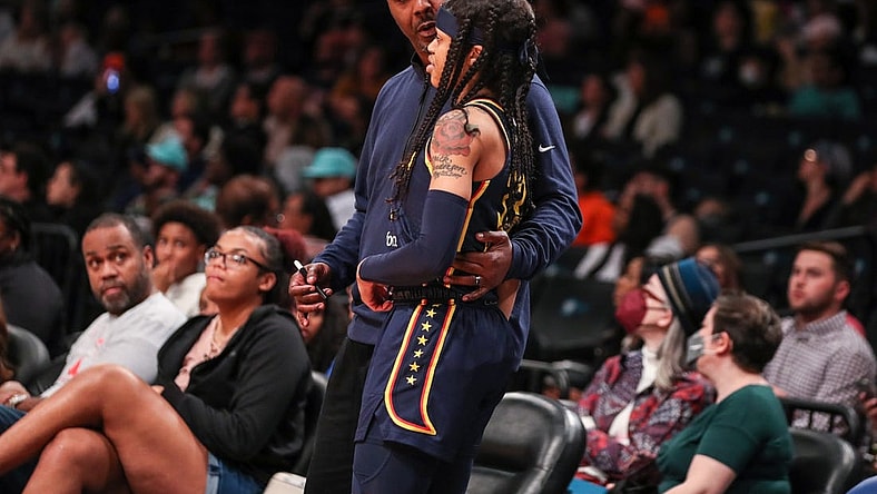 Jun 1, 2022; Brooklyn, New York, USA;  Indiana Fever head coach Carlos Knox and guard Destanni Henderson (33) at Barclays Center. Mandatory Credit: Wendell Cruz-USA TODAY Sports