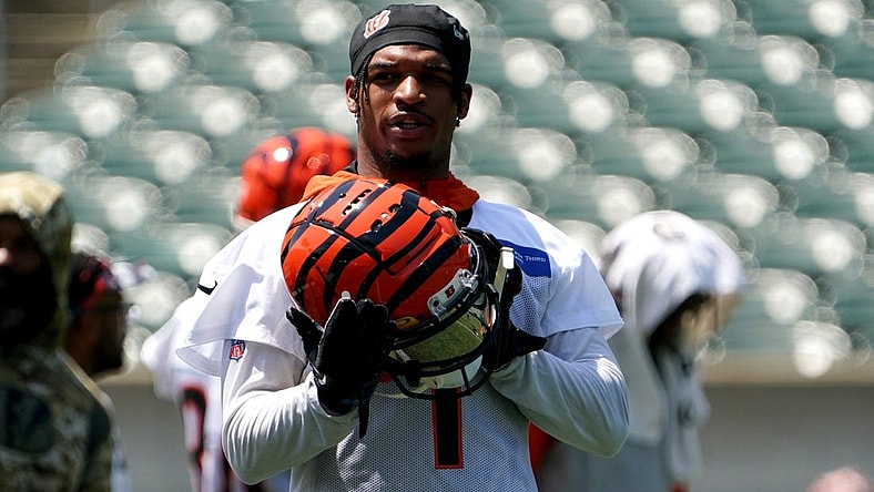 Cincinnati Bengals wide receiver Ja'Marr Chase (1) puts his helmet on between drills during organized team activities practice, Tuesday, June 14, 2022, at Paul Brown Stadium in Cincinnati.

Cincinnati Bengals Football Practice June 14 0053