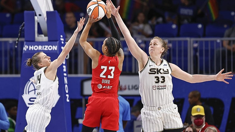 Jun 17, 2022; Chicago, Illinois, USA; Atlanta Dream guard Asia Durr (23) shoots against Chicago Sky guard Allie Quigley (14) and forward Emma Meesseman (33) during the second half of a WNBA game at Wintrust Arena. Mandatory Credit: Kamil Krzaczynski-USA TODAY Sports
