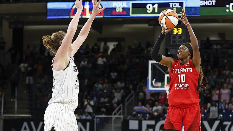 Jun 17, 2022; Chicago, Illinois, USA; Atlanta Dream guard Rhyne Howard (10) shoots against Chicago Sky forward Emma Meesseman (33) during the second half of a WNBA game at Wintrust Arena. Mandatory Credit: Kamil Krzaczynski-USA TODAY Sports