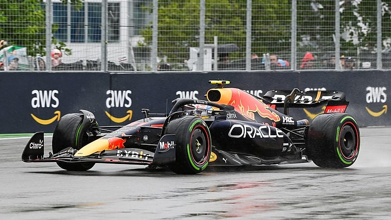 Jun 18, 2022; Montreal, Quebec, CAN; Red Bull Racing driver Sergio Perez of Mexico exits the fourteenth turn during the third free practice session at Circuit Gilles Villeneuve. Mandatory Credit: David Kirouac-USA TODAY Sports