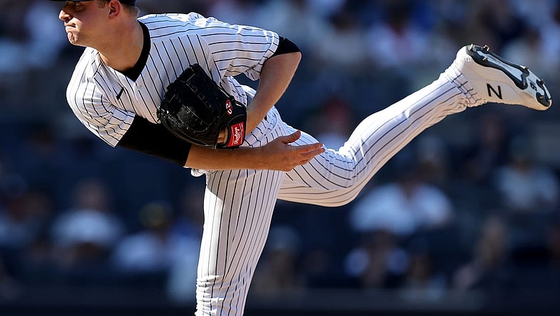 Jun 26, 2022; Bronx, New York, USA; New York Yankees starting pitcher Michael King (34) follows through on a pitch against the Houston Astros during the tenth inning at Yankee Stadium. Mandatory Credit: Brad Penner-USA TODAY Sports