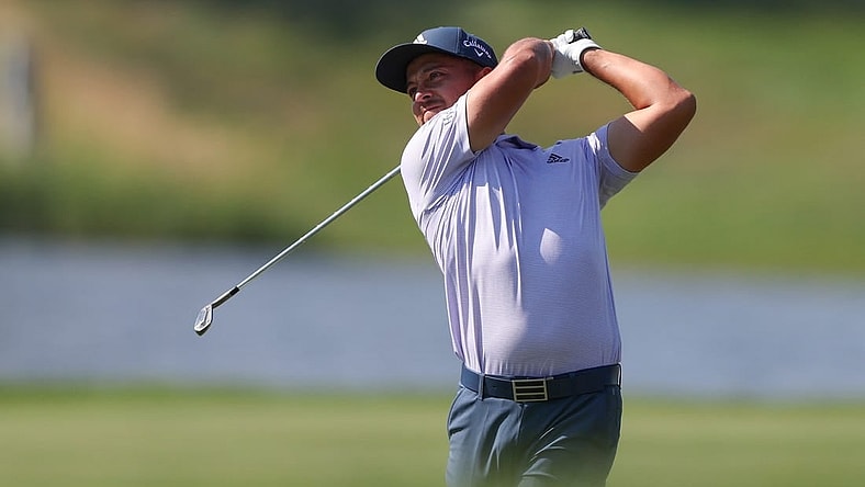 Jun 26, 2022; Cromwell, Connecticut, USA; Xander Schauffele plays a shot from the fairway of the 13th hole during the final round of the Travelers Championship golf tournament. Mandatory Credit: Vincent Carchietta-USA TODAY Sports