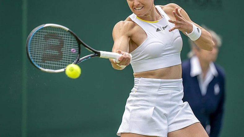 Jun 28, 2022; London, United Kingdom; Maria Sakkari (GRE) returns a shot during her first round match against Zoe Hives (AUS) on day two at All England Lawn Tennis and Croquet Club. Mandatory Credit: Susan Mullane-USA TODAY Sports
