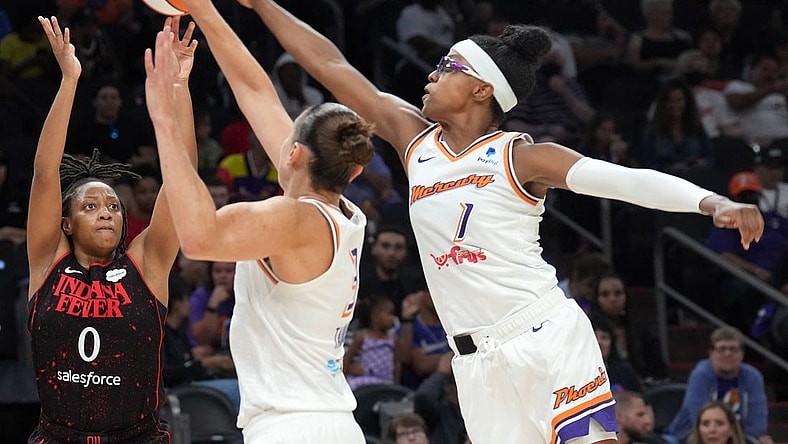 Jun 29, 2022; Phoenix, Arizona, USA; Phoenix Mercury guard Diamond DeShields (1) blocks a shot by Indiana Fever guard Kelsey Mitchell (0) during the second half at Footprint Center. Mandatory Credit: Joe Camporeale-USA TODAY Sports