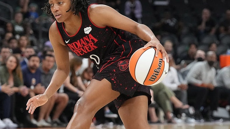 Jun 29, 2022; Phoenix, Arizona, USA; Indiana Fever guard Kelsey Mitchell (0) dribbles against the Phoenix Mercury during the second half at Footprint Center. Mandatory Credit: Joe Camporeale-USA TODAY Sports