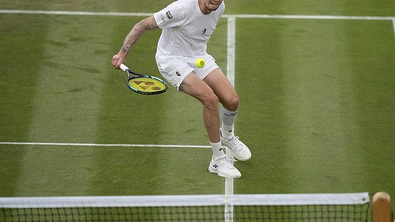 Jul 1, 2022; London, United Kingdom; Alexander Bublik (KAZ) returns a shot during his match against Frances Tiafoe (USA) on day five at All England Lawn Tennis and Croquet Club. Mandatory Credit: Susan Mullane-USA TODAY Sports