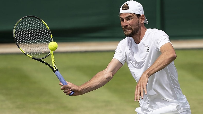 Jul 1, 2022; London, United Kingdom; Maxime Cressy (USA) returns a shot during his match against Jack Sock (USA) on day five at All England Lawn Tennis and Croquet Club. Mandatory Credit: Susan Mullane-USA TODAY Sports