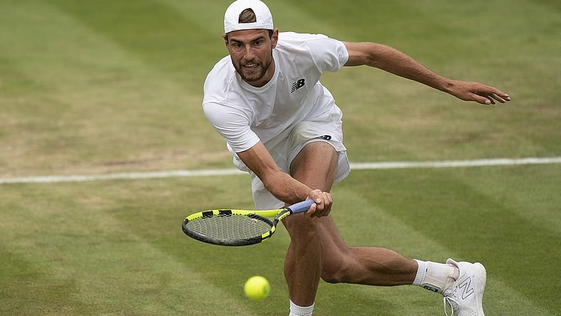 Jul 1, 2022; London, United Kingdom; Maxime Cressy (USA) returns a shot during his match against Jack Sock (USA) on day five at All England Lawn Tennis and Croquet Club. Mandatory Credit: Susan Mullane-USA TODAY Sports