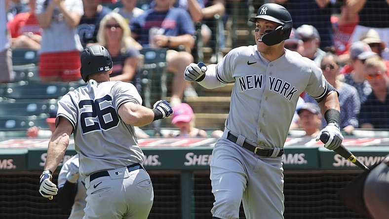 Jul 2, 2022; Cleveland, Ohio, USA; New York Yankees third baseman DJ LeMahieu (26) celebrates with designated hitter Aaron Judge (99) after hitting a home run during the third inning against the Cleveland Guardians at Progressive Field. Mandatory Credit: Ken Blaze-USA TODAY Sports