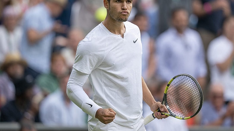 Jul 3, 2022; London, United Kingdom; Carlos Alcaraz (ESP) reacts to a point during his match against Jannik Sinner (ITA) on day seven at All England Lawn Tennis and Croquet Club. Mandatory Credit: Susan Mullane-USA TODAY Sports