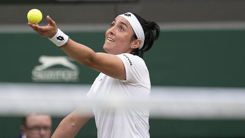 Jul 3, 2022; London, United Kingdom; Ons Jabeur (TUN) tosses the ball to serve during her match against Elise Mertens (BEL) on day seven at All England Lawn Tennis and Croquet Club. Mandatory Credit: Susan Mullane-USA TODAY Sports