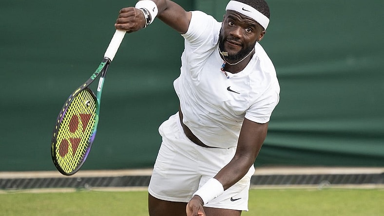 Jul 3, 2022; London, United Kingdom; Frances Tiafoe (USA) serves the ball during his match against David Goffin (BEL) on day seven at All England Lawn Tennis and Croquet Club. Mandatory Credit: Susan Mullane-USA TODAY Sports