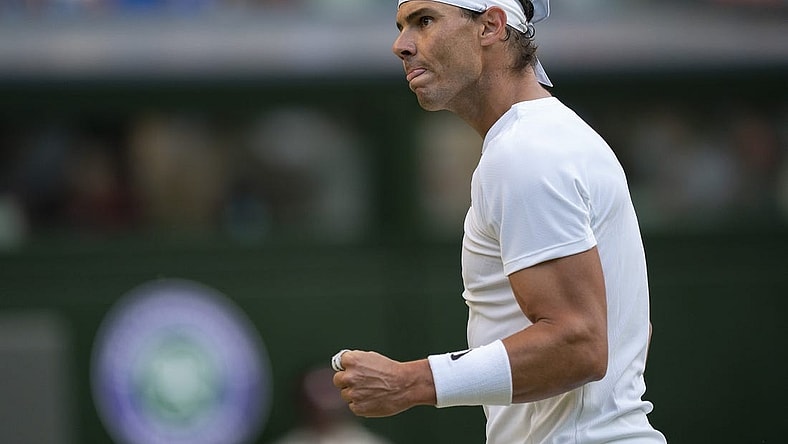 Jul 4, 2022; London, United Kingdom; Rafael Nadal (ESP) reacts to a point during his match against Botic Van De Zandschulp (NED) on day eight at All England Lawn Tennis and Croquet Club. Mandatory Credit: Susan Mullane-USA TODAY Sports