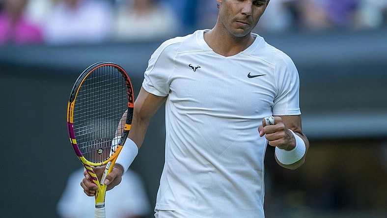 Jul 4, 2022; London, United Kingdom; Rafael Nadal (ESP) reacts to a point during his match against Botic Van De Zandschulp (NED) on day eight at All England Lawn Tennis and Croquet Club. Mandatory Credit: Susan Mullane-USA TODAY Sports