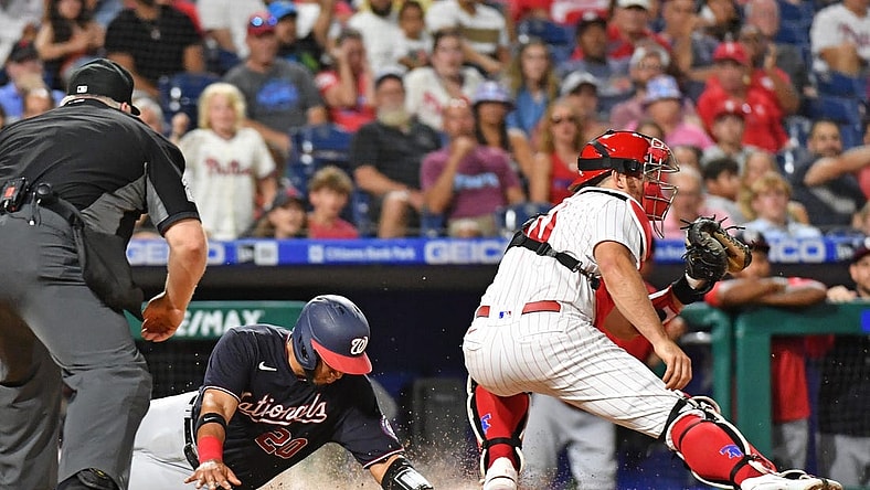 Jul 6, 2022; Philadelphia, Pennsylvania, USA; Washington Nationals catcher Keibert Ruiz (20) slides safely into home plate ahead of tag by Philadelphia Phillies catcher J.T. Realmuto (10) during the seventh inning at Citizens Bank Park. Mandatory Credit: Eric Hartline-USA TODAY Sports