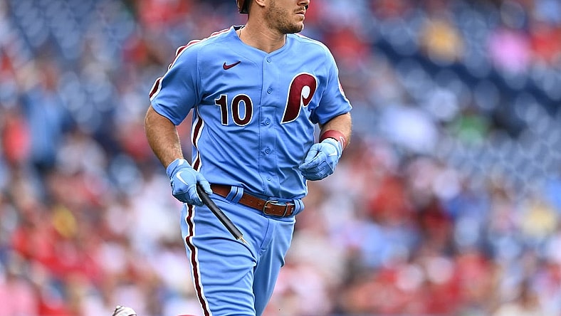 Jul 7, 2022; Philadelphia, Pennsylvania, USA; Philadelphia Phillies catcher JT Realmuto (10) carries a piece of his bat as he advances to first on a single against the Washington Nationals in the fifth inning at Citizens Bank Park. Mandatory Credit: Kyle Ross-USA TODAY Sports