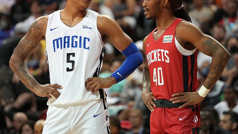 Jul 7, 2022; Las Vegas, NV, USA; Orlando Magic forward Paolo Banchero (5) talks to Houston Rockets forward Trhae Mitchell (40) during an NBA Summer League game at T&M. Mandatory Credit: Stephen R. Sylvanie-USA TODAY Sports