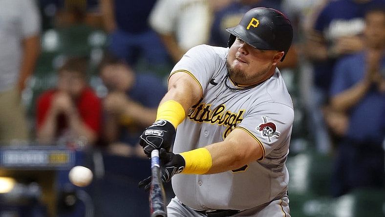 Jul 8, 2022; Milwaukee, Wisconsin, USA;  Pittsburgh Pirates first baseman Daniel Vogelbach (19) hits an RBI single during the ninth inning against the Milwaukee Brewers at American Family Field. Mandatory Credit: Jeff Hanisch-USA TODAY Sports