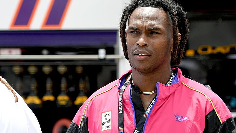Jul 10, 2022; Hampton, Georgia, USA; Former Falcons receiver Julio Jones stands on the grid prior to the Quaker State 400 at Atlanta Motor Speedway. Mandatory Credit: Adam Hagy-USA TODAY Sports