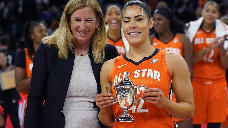 Jul 10, 2022; Chicago, Ill, USA; WNBA commissioner Cathy Engelbert presents the WNBA All Star Game MVP Award to Team Wilson guard Kelsey Plum at Wintrust Arena. Mandatory Credit: David Banks-USA TODAY Sports