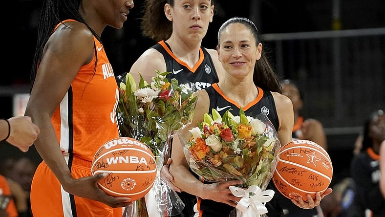 Jul 10, 2022; Chicago, Ill, USA; Team Stewart guard Sue Bird (right) and Team Wilson center Sylvia Fowles (left) are presented with flowers during the first half in a WNBA All Star Game at Wintrust Arena. Mandatory Credit: David Banks-USA TODAY Sports