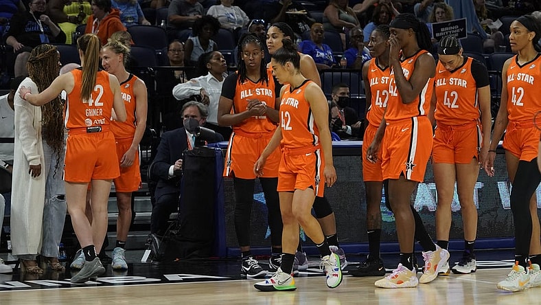 Jul 10, 2022; Chicago, Ill, USA; Players wear the number 42 to honor Brittany Griner as they greet Cherelle Griner (left) Brittany   s spouse during the second half in a WNBA All Star Game at Wintrust Arena. Mandatory Credit: David Banks-USA TODAY Sports