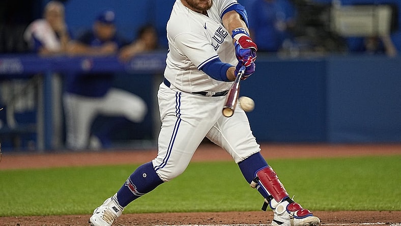 Jul 12, 2022; Toronto, Ontario, CAN; Toronto Blue Jays designated hitter Alejandro Kirk (30) hits a single against the Philadelphia Phillies during the sixth inning at Rogers Centre. Mandatory Credit: John E. Sokolowski-USA TODAY Sports
