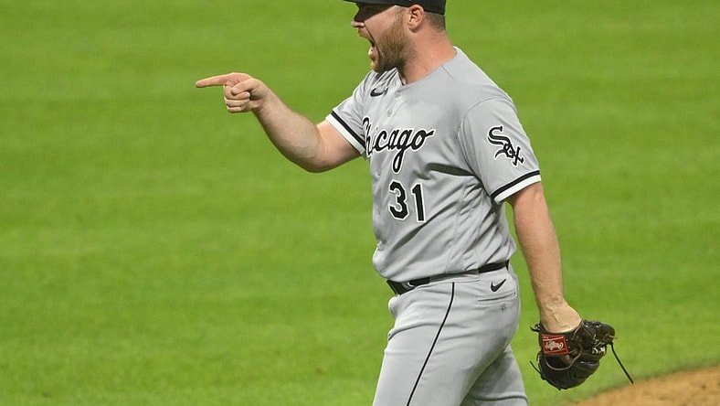 Jul 13, 2022; Cleveland, Ohio, USA; Chicago White Sox relief pitcher Liam Hendriks (31) celebrates a win over the Cleveland Guardians at Progressive Field. Mandatory Credit: David Richard-USA TODAY Sports