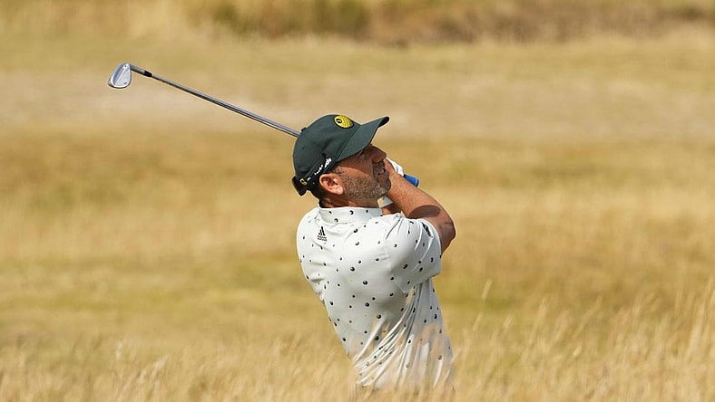 Jul 16, 2022; St. Andrews, SCT; Sergio Garcia plays his second shot on the 13th hole during the third round of the 150th Open Championship golf tournament. Mandatory Credit: Rob Schumacher-USA TODAY Sports