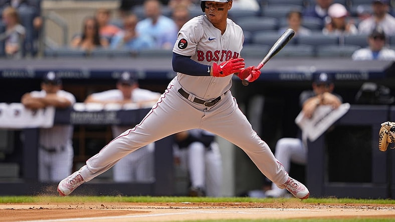 Jul 17, 2022; Bronx, New York, USA; Boston Red Sox third baseman Rafael Devers (11) reacts to an inside pitch during the first inning against the New York Yankees at Yankee Stadium. Mandatory Credit: Gregory Fisher-USA TODAY Sports