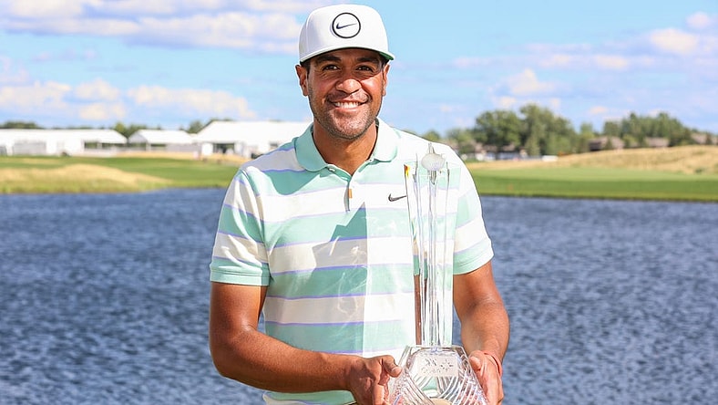 Jul 24, 2022; Blaine, Minnesota, USA; Tony Finau poses with the trophy after winning the 3M Open golf tournament. Mandatory Credit: Matt Krohn-USA TODAY Sports